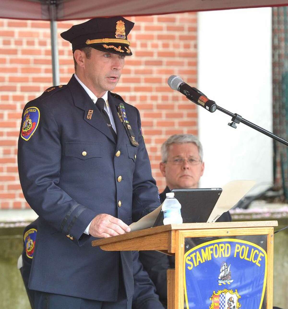 Hour Photo/Alex von Kleydorff Assistant Police Chief James Matheny speaks about how officers risk their lives during Stamford's Peace Office Memorial Day at Headquaters