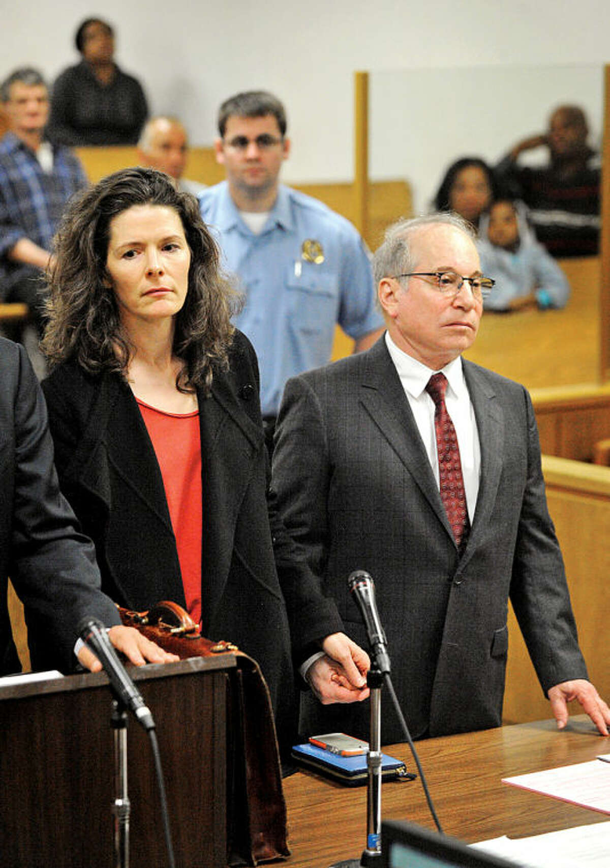 Paul Simon and his wife Edie Brickell hold hands inside the Norwalk Conn. Superior Court House Friday May, 16, 2014 for a domestic dispute hearing . (Pool Photo/Douglas Healey).