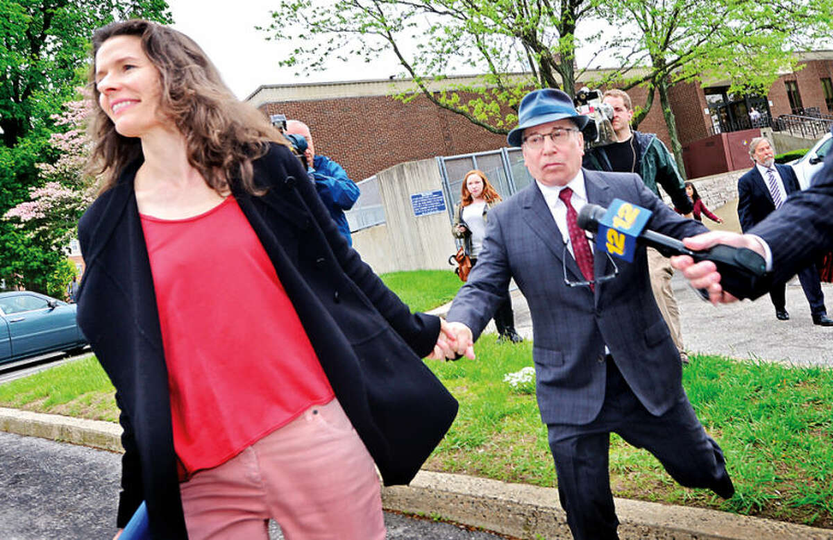 Hour photo / Erik Trautmann Edie Brickell and husband Paul Simon were in Norwalk Superior Court Friday asking for a continuance on the domestic dispute case.