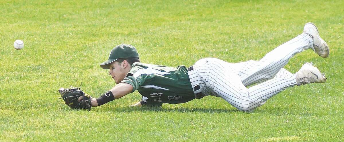 Hour photo/John Nash - Norwalk's Reid Singewald can't come up with a diving catch during Wednesday's CIAC Class LL semifinal game at Muzzy Field in Bristol. Staples defeated Norwalk, 11-0.