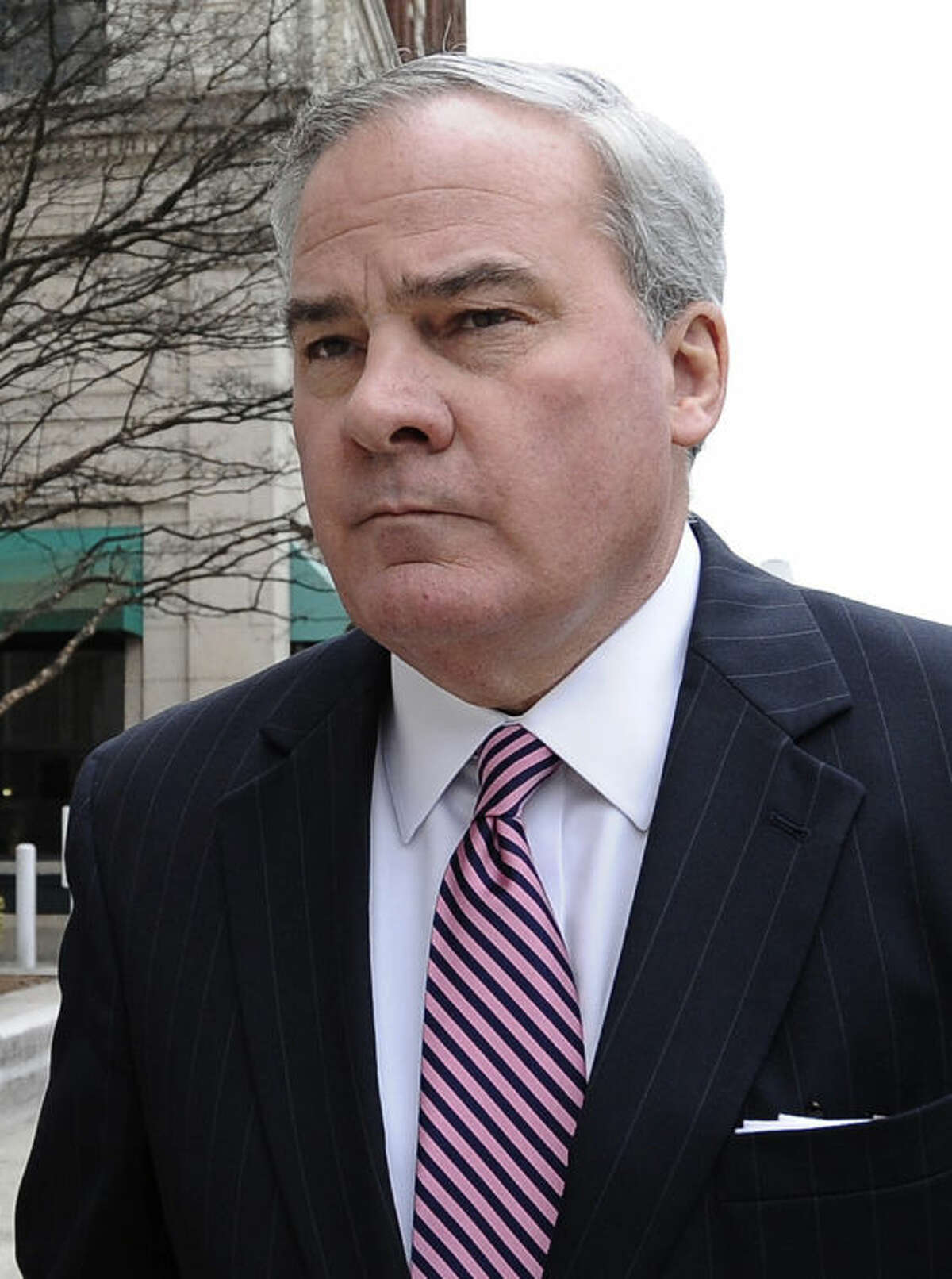 FILE - In this April 11, 2014 file photo, former Connecticut Gov. John G. Rowland arrives at federal court in New Haven, Conn., where a grand jury had returned a seven-count indictment the previous day alleging Rowland schemed to conceal involvement with congressional campaigns. Rowland's attorneys filed a motion filed Tuesday, May 20, 2014, seeking to dismiss the charges that he broke federal election laws in his roles with the two congressional campaigns.(AP Photo/Jessica Hill, File)