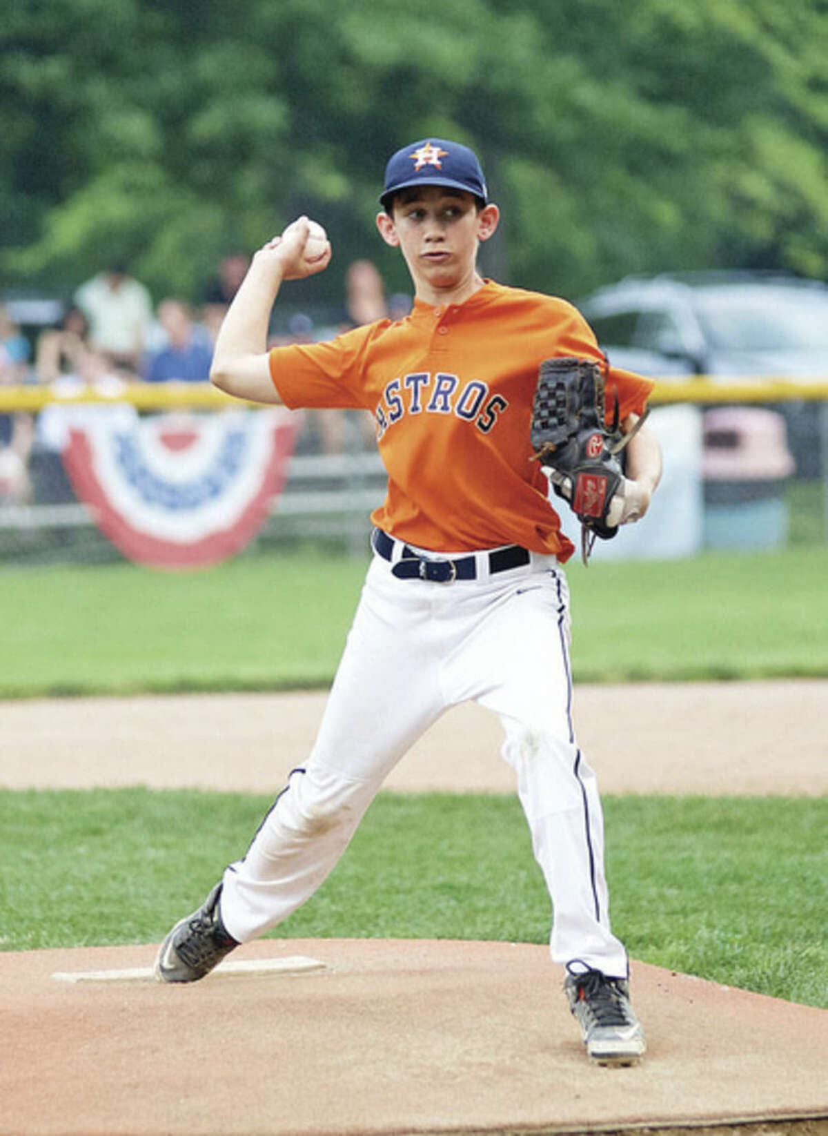Hour photo/Danielle Calloway Astros pitcher Andrew Travers about to throw a strike during the Wilton Little League Majors Division Championship game against the Giants on Thursday evening at Bill Terry Field in Wilton.