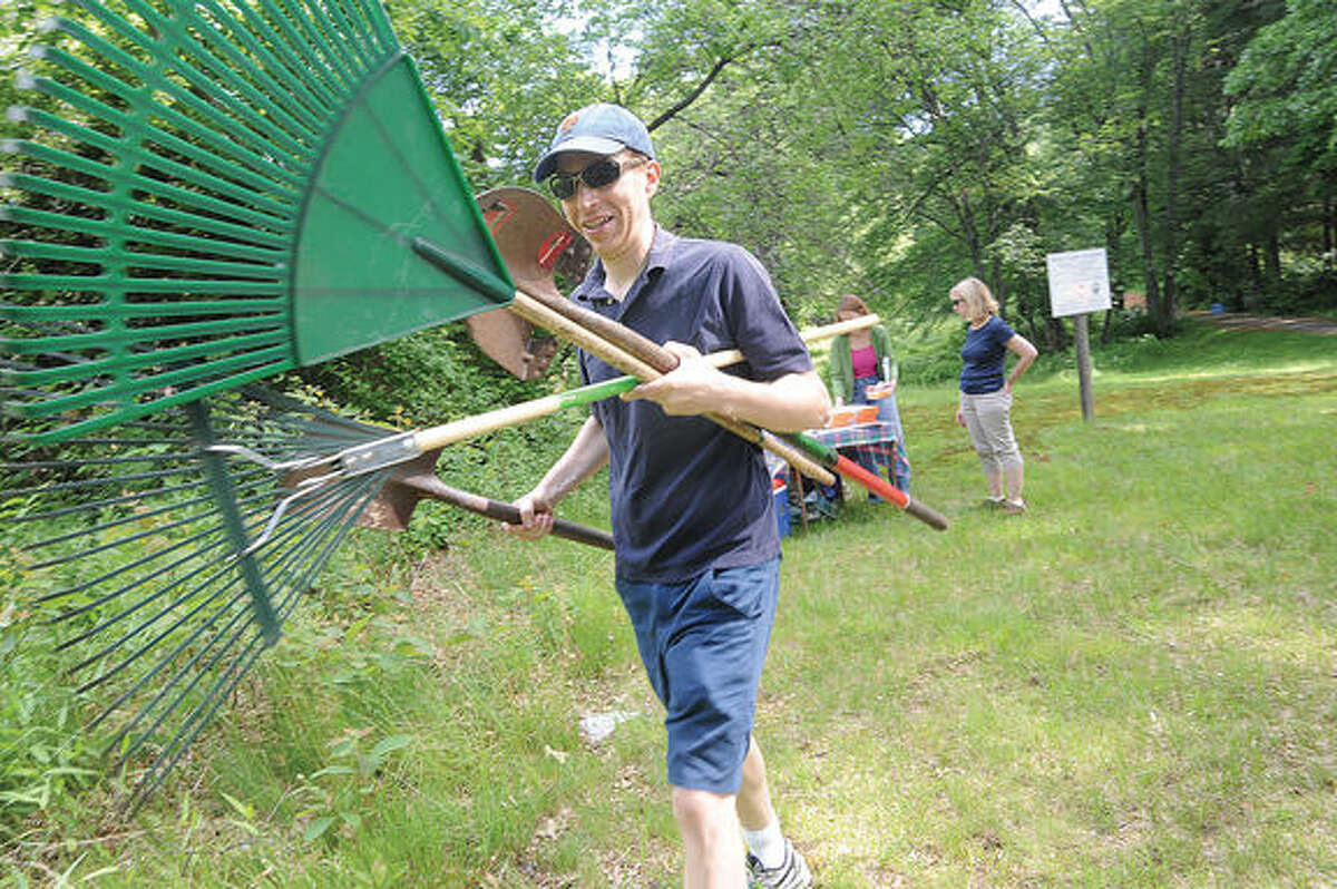 Bob Welsh, member of Save Cranbury, Again and with Board of Directors of the Norwalk Landtrust takes part in the cleanup of the White Barn Preserve along with members of The Westport RTM and Save Westport Now on Saturday. Hour photo/Matthew Vinci