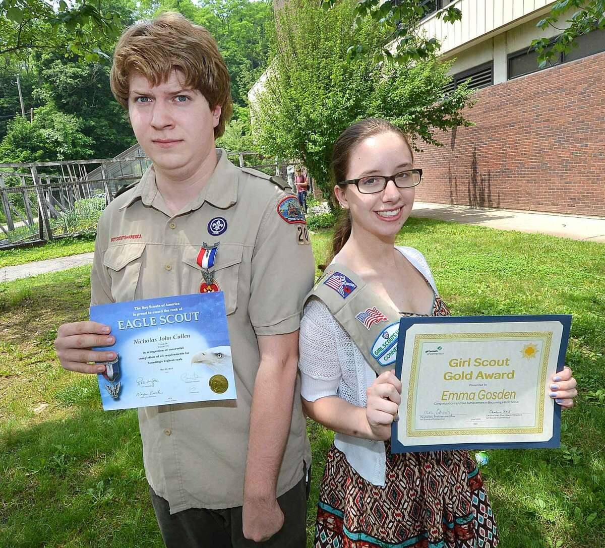 Wilton High School seniors Nicholas Cullen, an Eagle Scout, and Emma Gosden with their awards. Not pictured is Caroline Costello, who was also honored by the Girl Scouts of the U.S.A. 