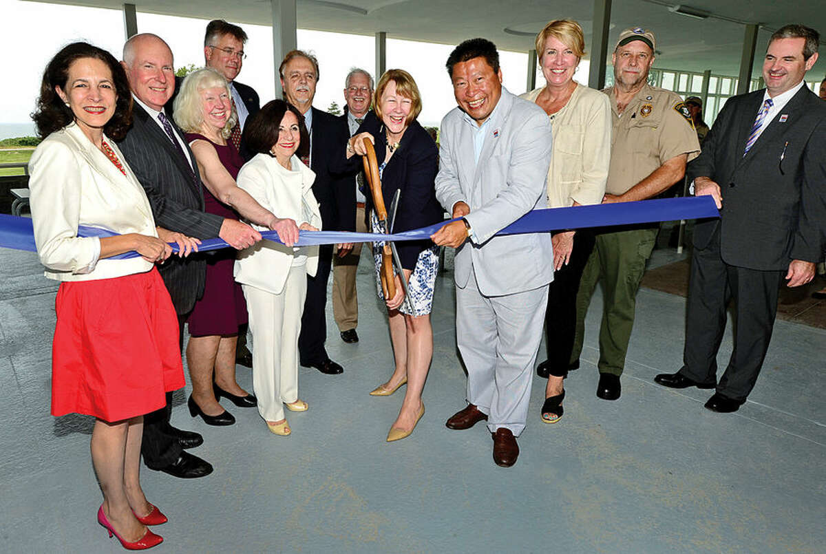 Hour photo / Erik Trautmann Local officials including State Representative Gail Lavielle, Westport First Seleman Jim Marpe, Friends of Sherwood Island President, LIz-Ann Koos, State Repersentative John Shaban, State Senator Toni Boucher, DAS Deputy Commissioner Bud Salemi, DAS project manager Lee Rowley, CT DEEP Deputy Commsioner Susan Whalen, State Representative Tony Huang, State Representative Laura Devlin, Park Supervisor Jim Beschle, and Director of CT State Parks Tom Tyler , cut the ribbon during a ceremony for the newly renovated Sherwood Island State Park Pavilion Tuesday afternoon.