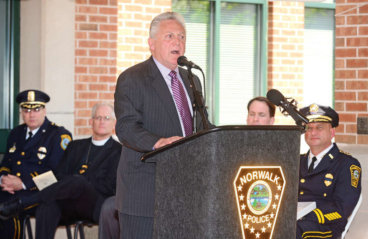 Hour photo / Erik Trautmann Norwalk Harry Rilling makes his remarks during the annual Norwalk Police Department Police Memorial Service Friday at police headquarters.