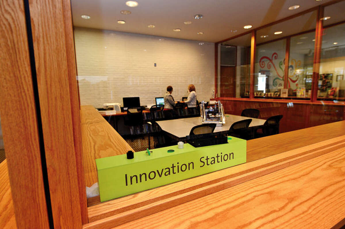 The new Innovation Station room at Wilton Library houses different tools and resources for group learning, including a 3-D printer.