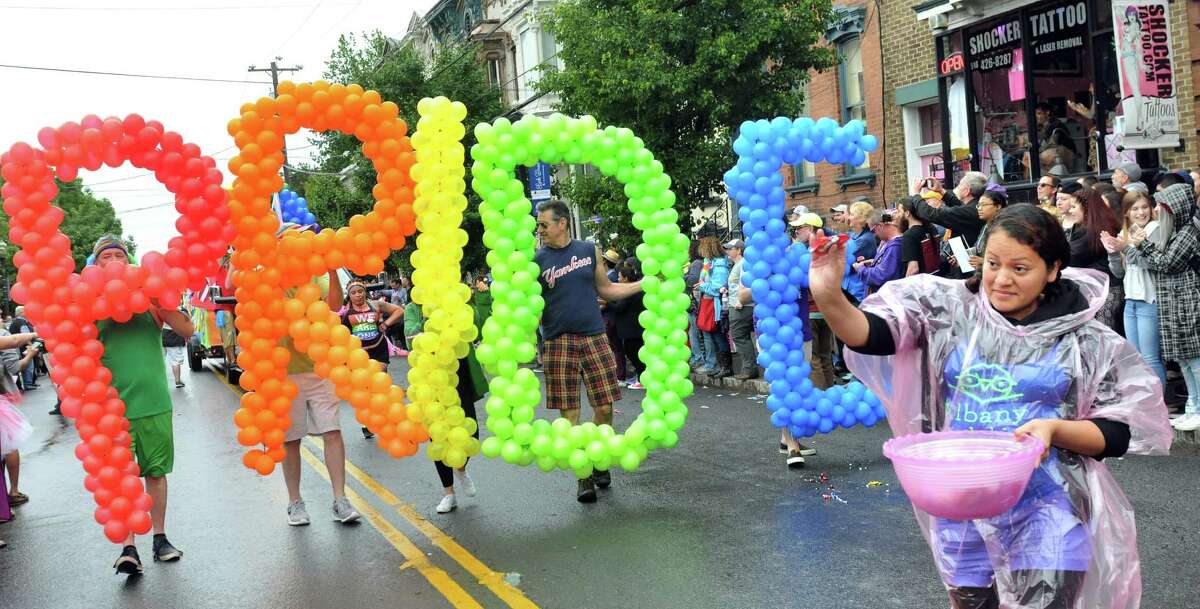 Marchers show their colors in the Capital PRIDE Parade on Saturday, June 11, 2016, in Albany, N.Y. The annual parade, festival and rally celebrates the Lesbian, Gay, Bisexual, Transgender and Queer community with entertainment and family-friendly activities. (Cindy Schultz / Times Union)