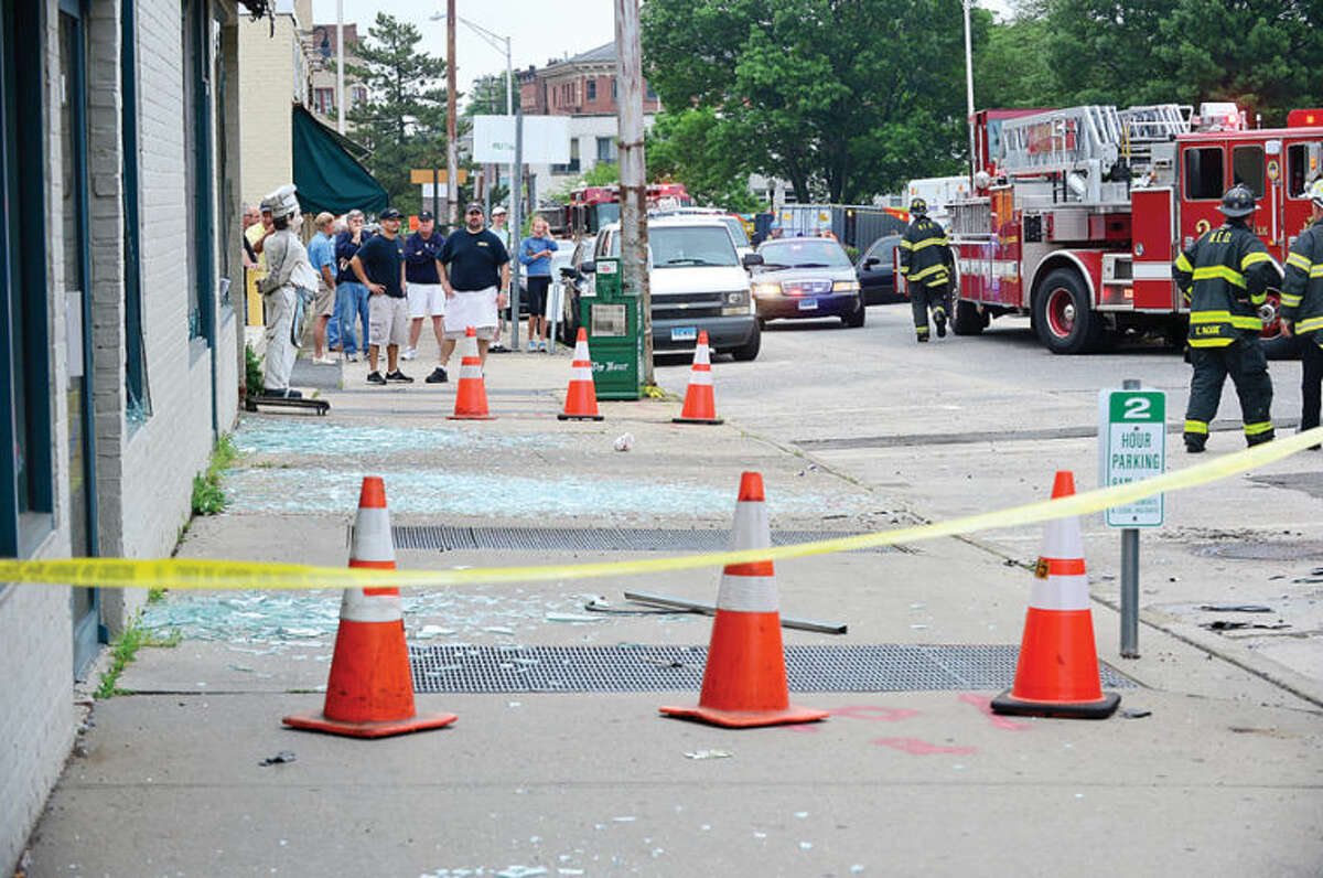 Hour photo / Erik Trautmann An underground explosion rocked Main St Tuesday morning blowing out windows at Muro's New York Bakery and knocking out power to the area.