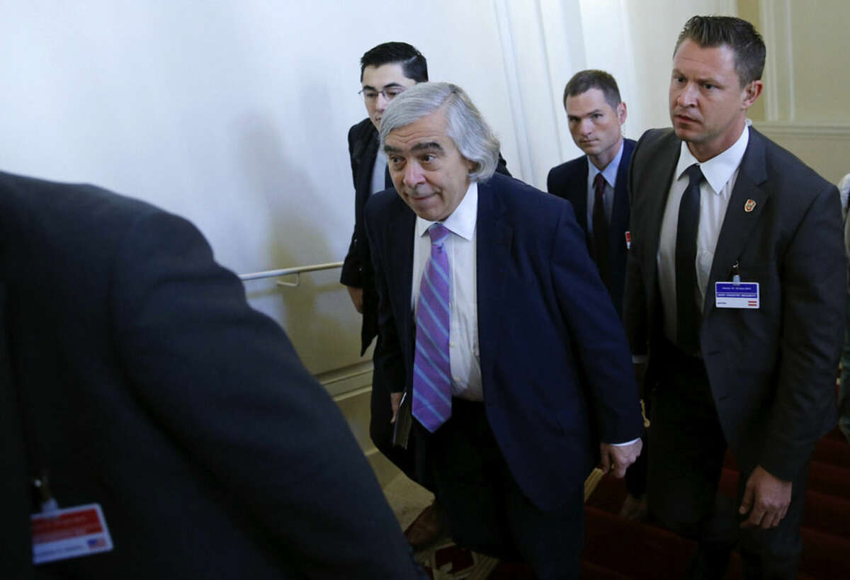 U.S. Secretary of Energy Ernest Moniz, centre, arrives for a meeting at an hotel in Vienna, Thursday, July 9, 2015. Negotiations over Iran's nuclear program lurched toward another deadline on Thursday with diplomats reconvening amid persistent uncertainty and vague but seemingly hopeful pronouncements from participants. (Carlos Barria/Pool Photo via AP)