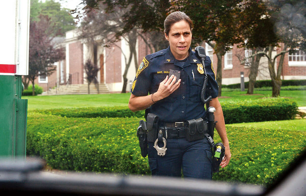 Hour photo / Erik Trautmann Norwalk police seargent Sophia Gulino wears a body camera during patrol Thursday as the department begins a training with the devices.