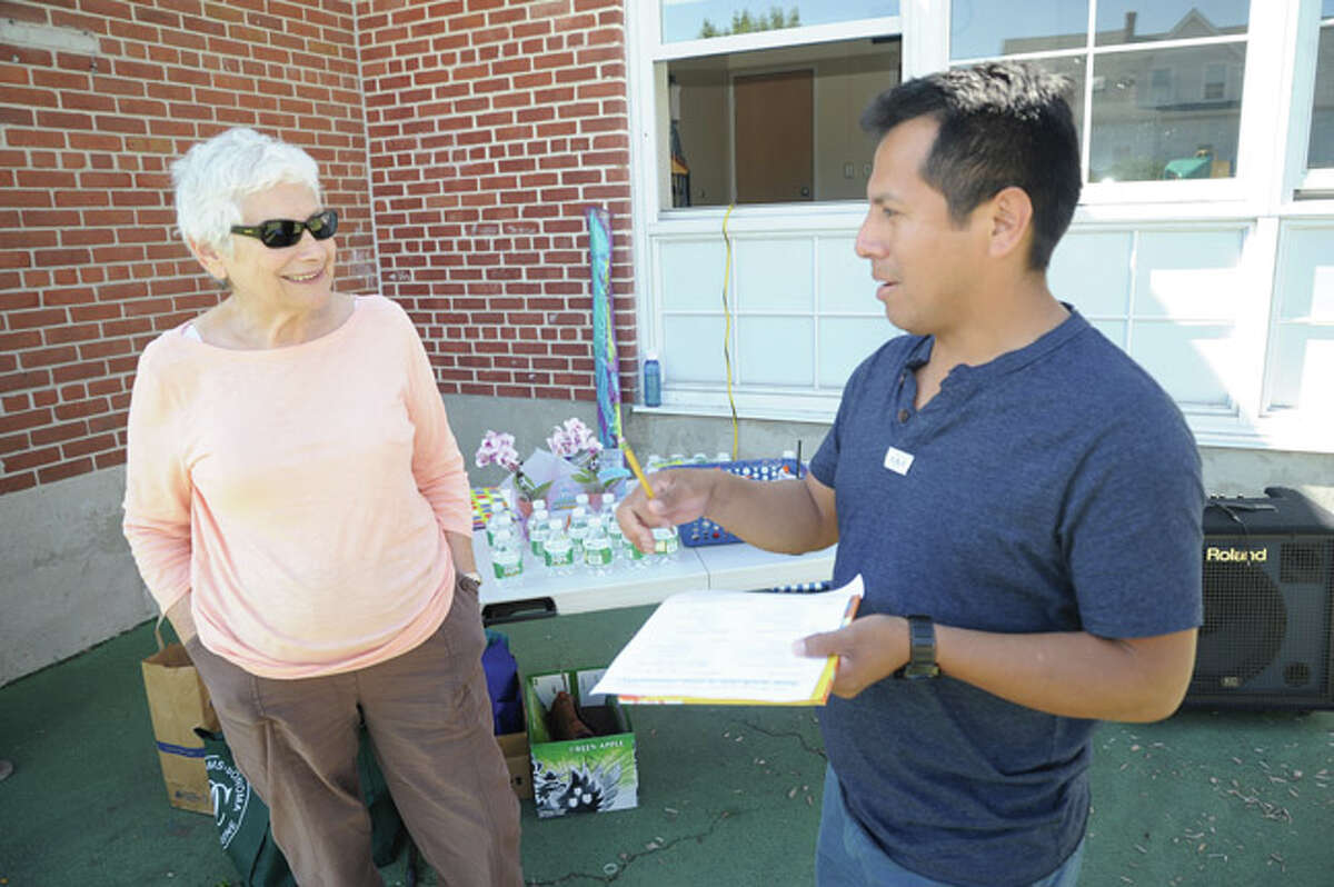Frieda Knopf and Frankiln Pascual at K.T. Murphy Elementary School in Stamford. Franklin and other parents filled out forms making a checklist of how walkable the area is around the school.