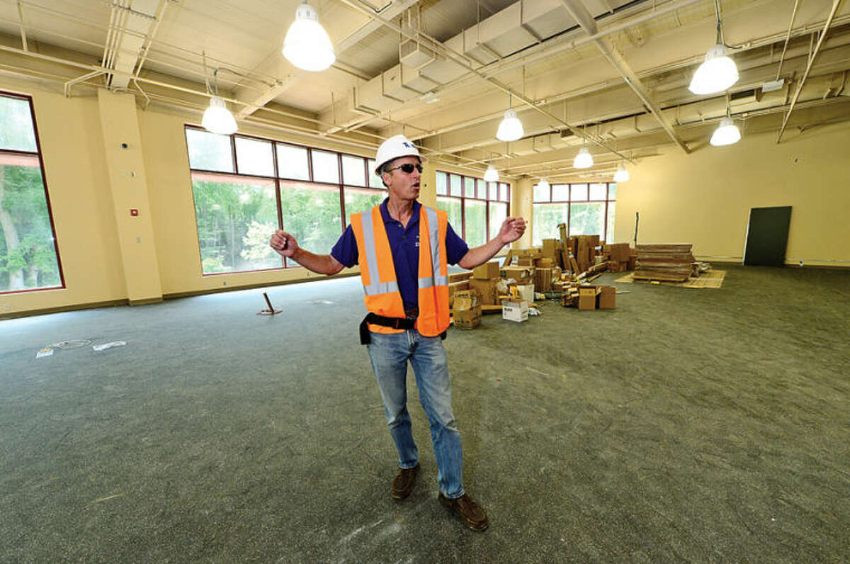 Hour photo / Erik Trautmann Westport Weston YMCA Communications Director Scott Smith leads a tour of the new Westport Weston Familty Y 54,000-square-feet facility including the Robin Tauck Wellness Center set to open this fall.