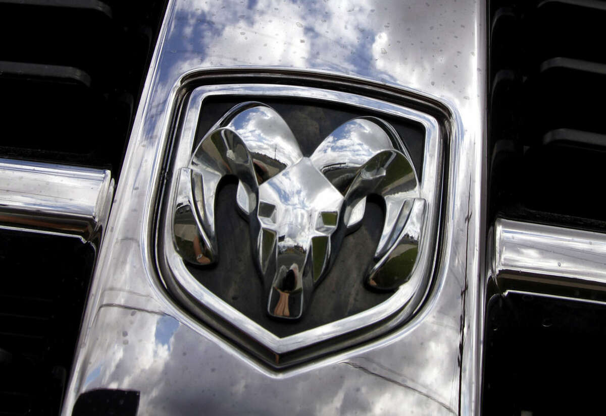 FILE - This July 13, 2011, file photo shows the Ram logo on a Ram pickup truck at a dealership in Hillsboro, Ore. Fiat Chrysler will buy back about 300,000 Ram pickup trucks in the biggest such action in U.S. history as part of a deal with U.S. safety regulators to settle legal problems in about two-dozen recalls, two people briefed on the matter say. (AP Photo/Don Ryan, File)