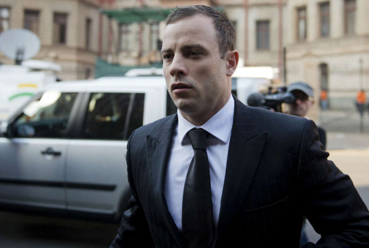 Oscar Pistroius arrives at court in Pretoria, South Africa, Monday, June 30, 2014. The murder trial resumed after one month during which mental health experts evaluated the athlete to determine if he has an anxiety disorder that could have influenced his actions on the night he killed his girlfriend Reeva Steenkamp. (AP Photo)