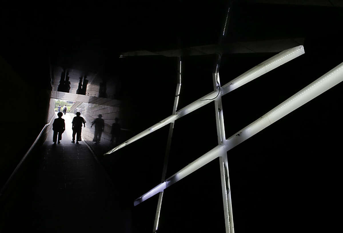 Visitor walk by light decorations at a tunnel near the Cheonggye stream in Seoul, South Korea, Tuesday, July 28, 2015. (AP Photo/Lee Jin-man)