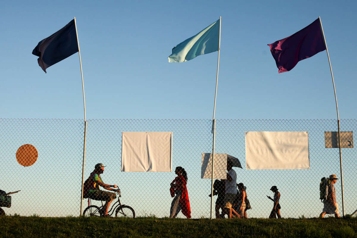 Hour photo/Chris Palermo. Festival goers enjoy the Gathering of the Vibes festival at Seaside Park in Bridgeport Friday.