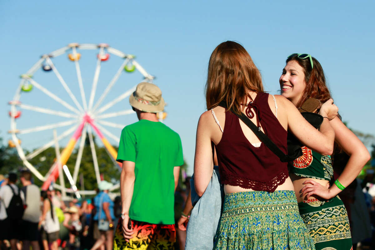 Hour photo/Chris Palermo. Festival goers enjoy the Gathering of the Vibes festival at Seaside Park in Bridgeport Friday.