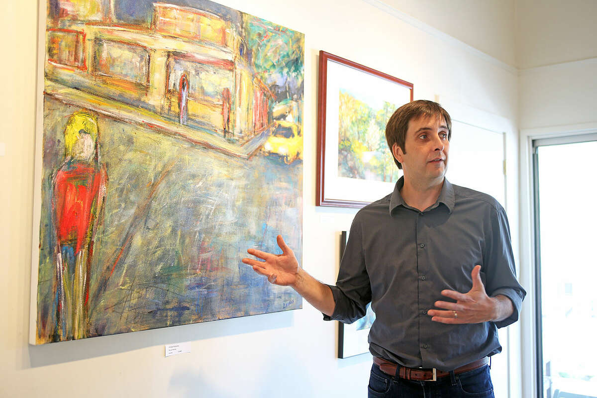 Bruce Horan, President, talks about his painting called Chicken & Honey, part of the Brushwork 2015 show at the Rowayton Arts Center Saturday morning. Hour Photo / Danielle Calloway