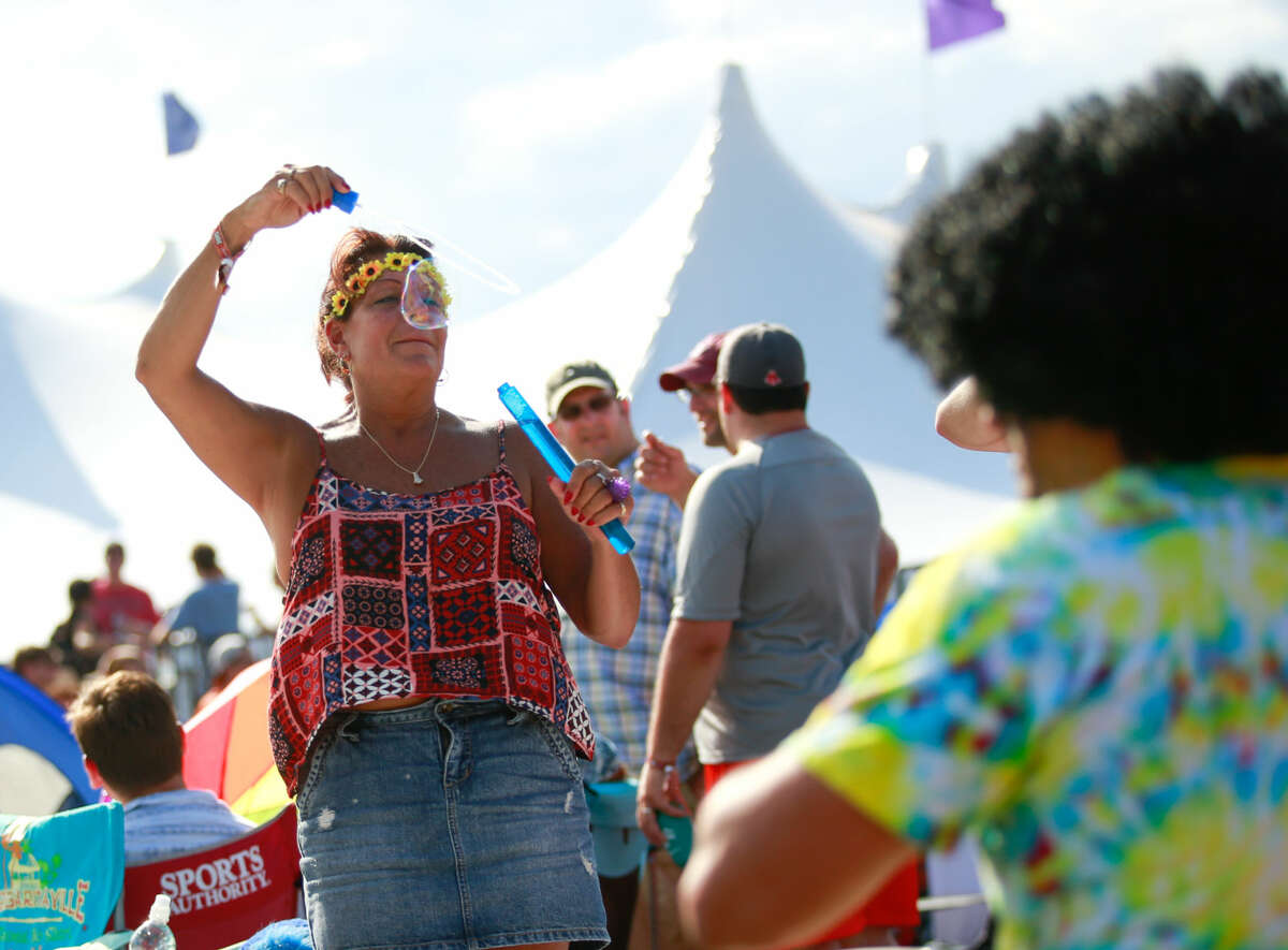 Hour photo/Chris Palermo. Festival goers enjoy the Gathering of the Vibes festival at Seaside Park in Bridgeport Saturday.