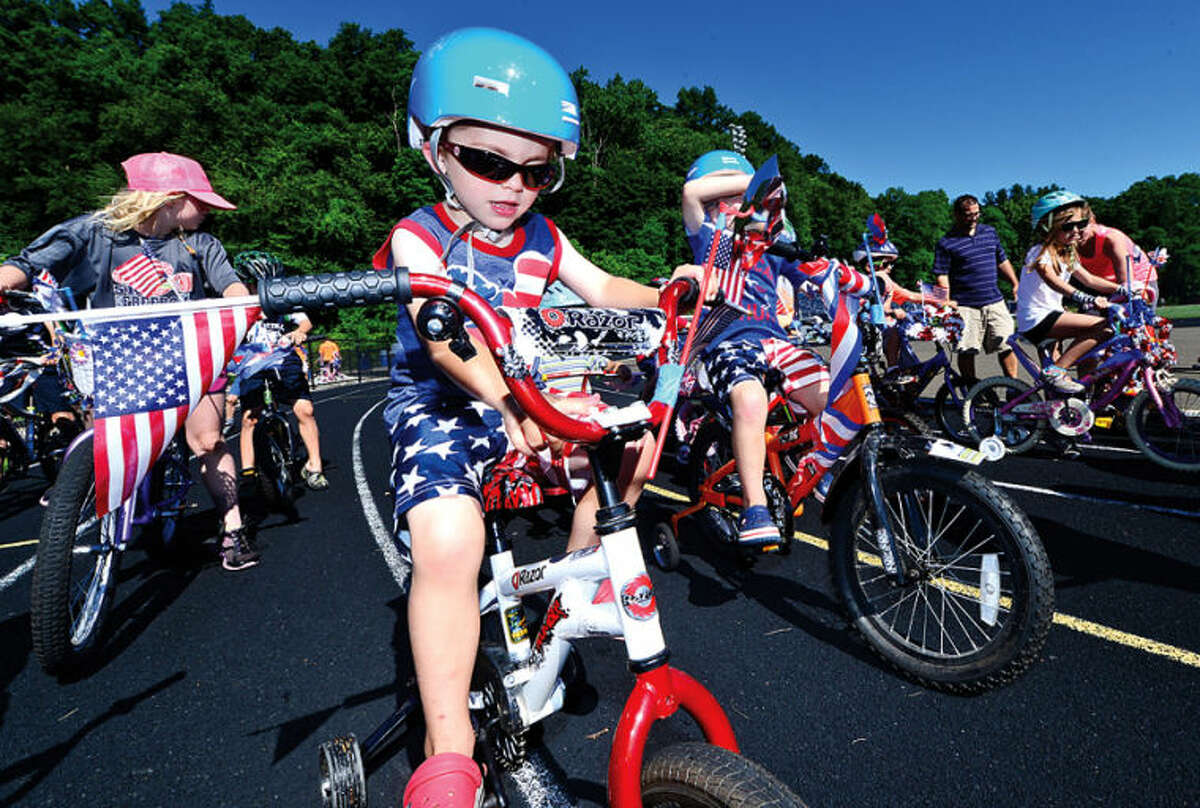 Hour photo / Erik Trautmann 3 year old Jack Major participates in the Cannondale Bike Rodeo at Fujitani Field as part of Wilton's Independence Day festivities Saturday.