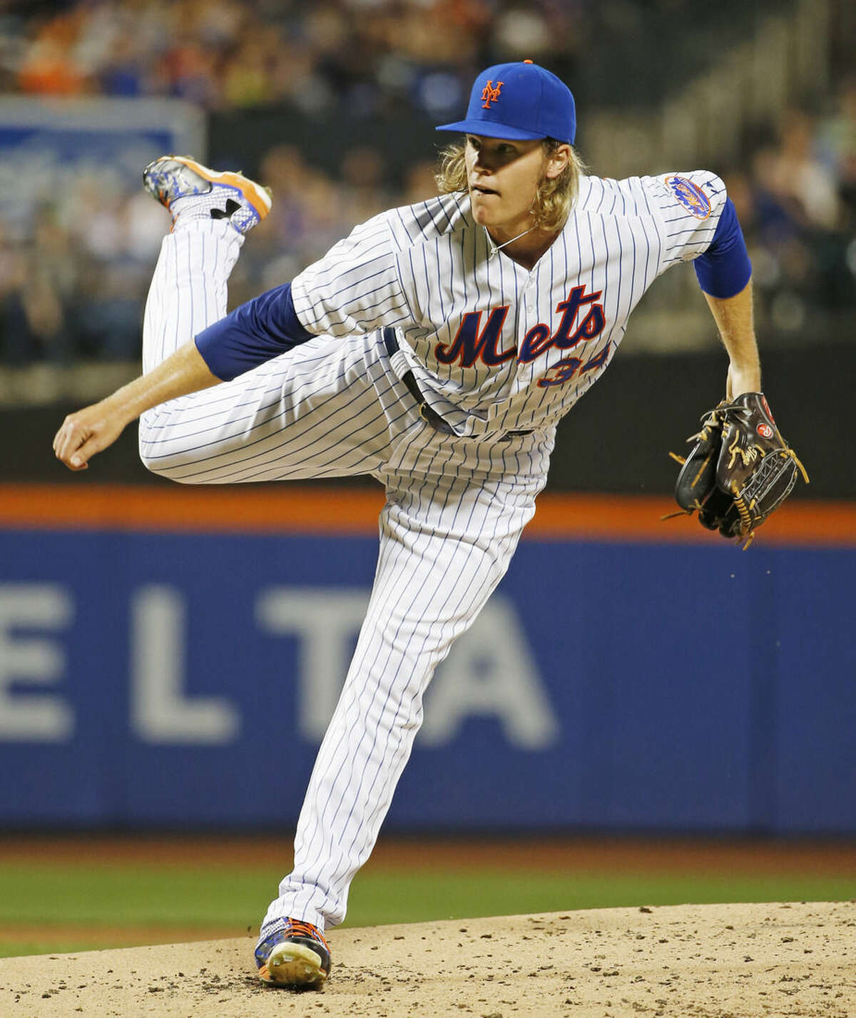 New York Mets starting pitcher Noah Syndergaard delivers during the second inning of a baseball game against the Washington Nationals in New York, Sunday, Aug. 2, 2015. (AP Photo/Kathy Willens)