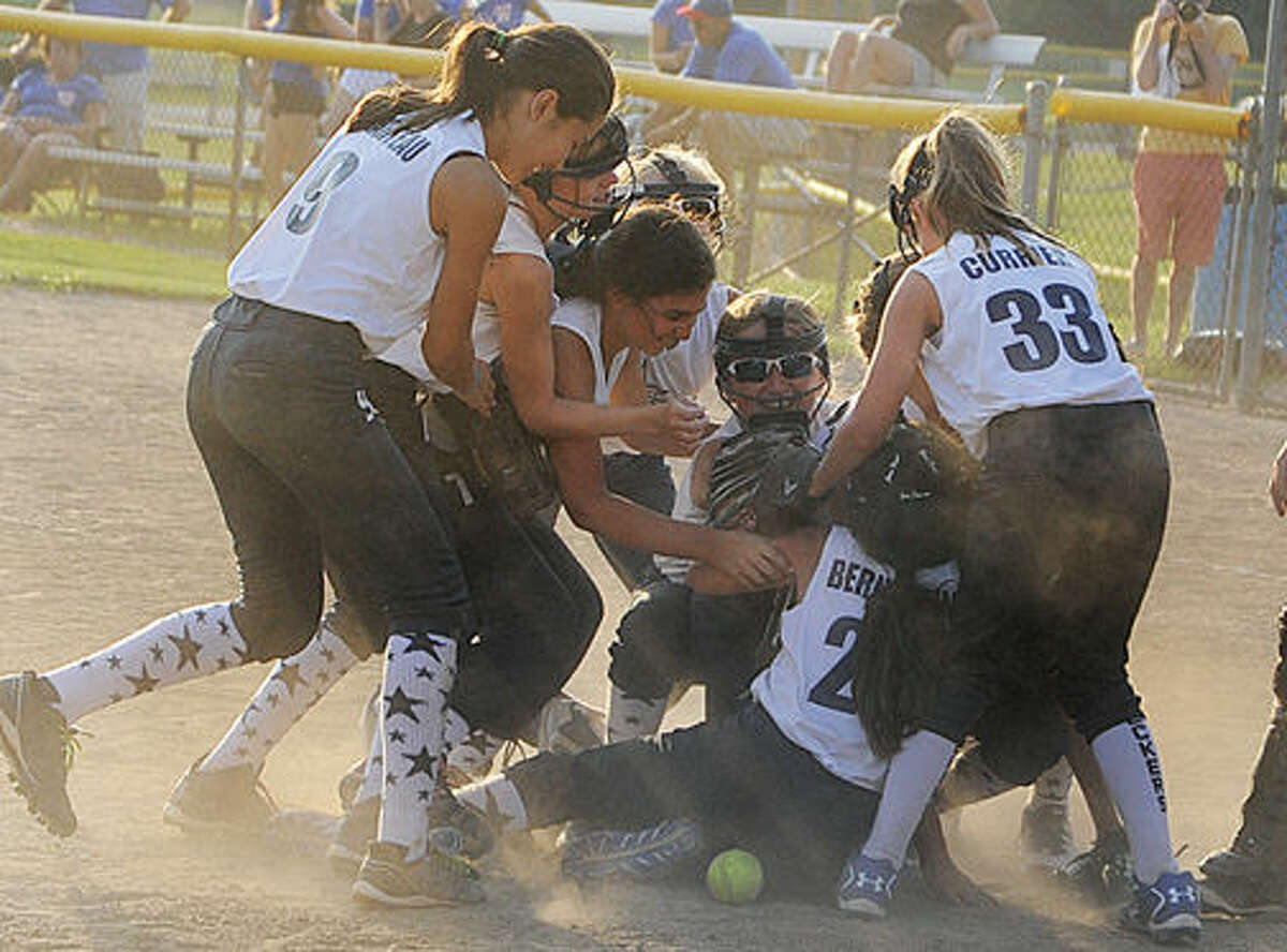 Westport girls softball celebrates in the win against Waterford in the state championship game. Hour photo/Matthew Vinci