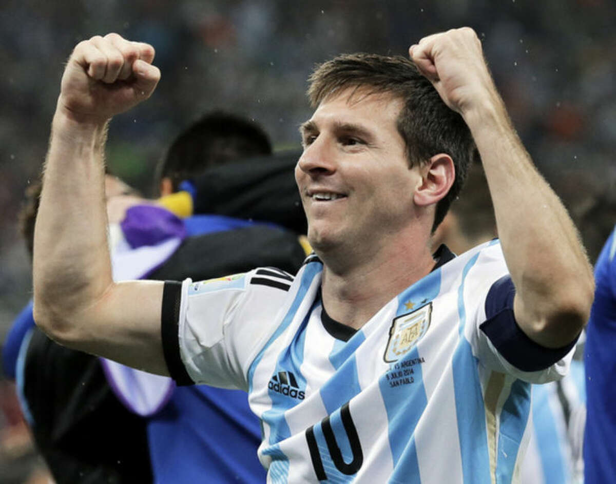 Argentina's Lionel Messi pumps his fists after Argentina defeated the Netherlands 4-2 in a penalty shootout after a 0-0 tie after extra time to advance to the finals after the World Cup semifinal soccer match between the Netherlands and Argentina at the Itaquerao Stadium in Sao Paulo Brazil, Wednesday, July 9, 2014. (AP Photo/Victor R. Caivano)