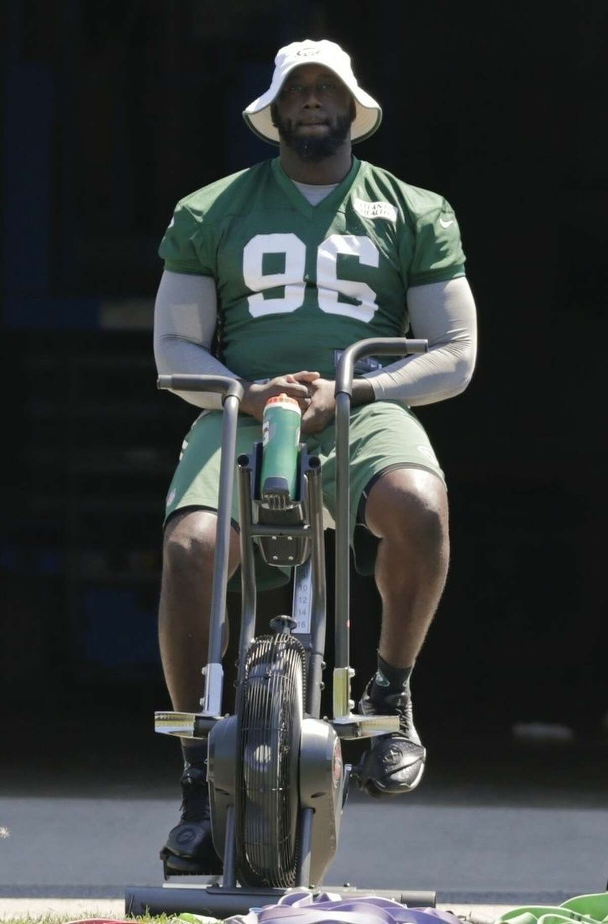 New York Jets' Muhammad Wilkerson rides a stationary bike during practice at NFL football training camp, Tuesday, Aug. 4, 2015, in Florham Park, N.J. (AP Photo/Frank Franklin II)