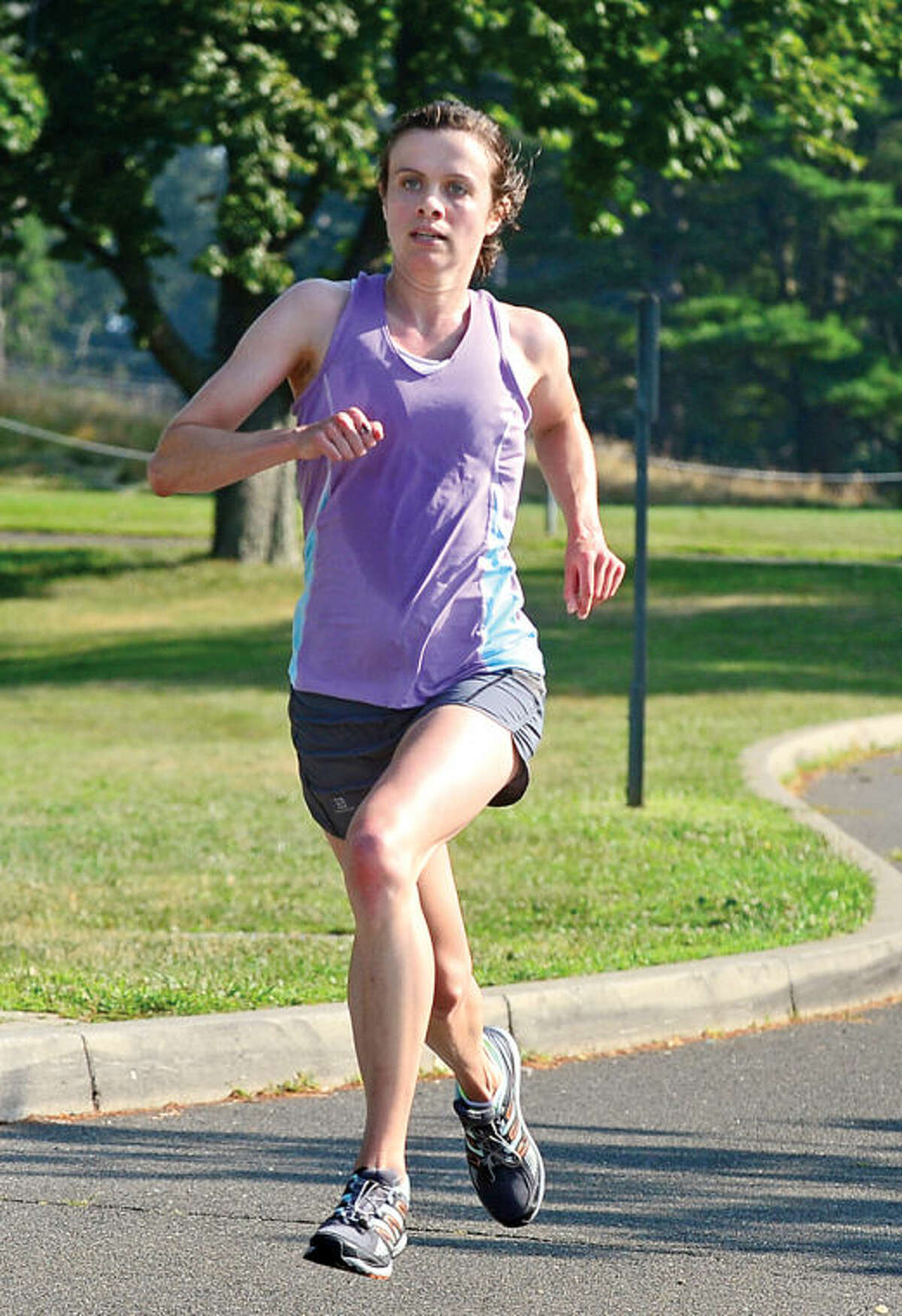 Hour photo / Erik Trautmann Kerry Lyons was the first woman finisher in the Westport Road Runners race no. 3, a 3.8 miler, at Longshore park Saturday.