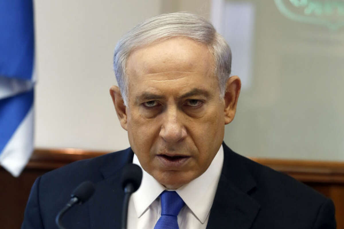 Israeli Prime Minister Benjamin Netanyahu chairs the weekly cabinet meeting in his office in Jerusalem, Sunday, July 6, 2014. Prime Minister Benjamin Netanyahu on Sunday said Israel would act calmly and responsibly in the face of rising Israeli-Palestinian hostilities, just hours after Israel's military carried out airstrikes on 10 sites in the Gaza Strip. (AP Photo/Gali Tibbon, Pool)