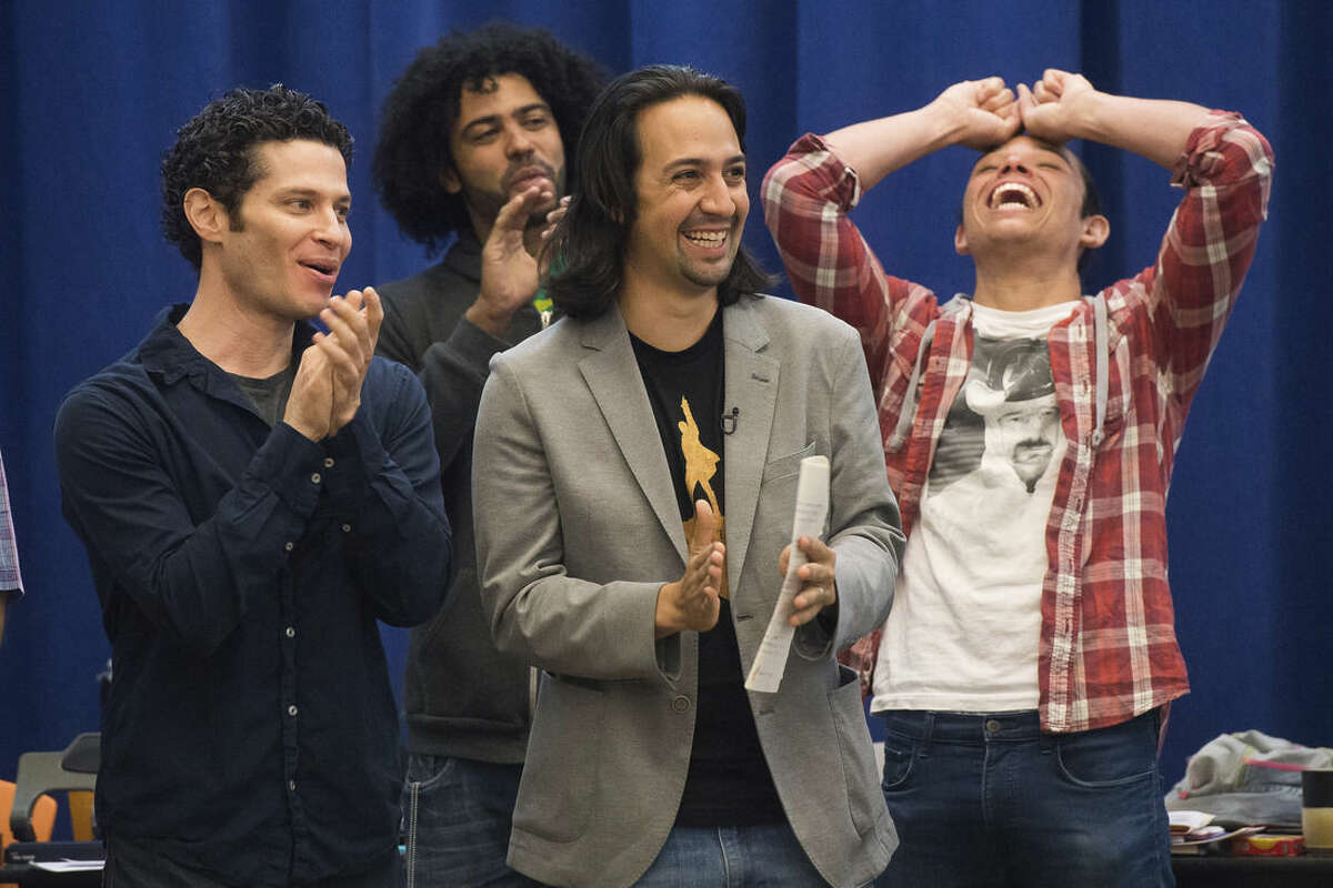 FILE - In this June 18, 2015 file photo, "Hamilton" director, Thomas Kail, from left, and cast members Daveed Diggs, Lin-Manuel Miranda and Anthony Ramos begin Broadway rehearsals at the New 42nd Street Studios in New York. Few shows in recent memory have excited the New York theater community like Miranda's hip-hop flavored biography about Alexander Hamilton, the nation's first treasury secretary. (Photo by Charles Sykes/Invision/AP, File)