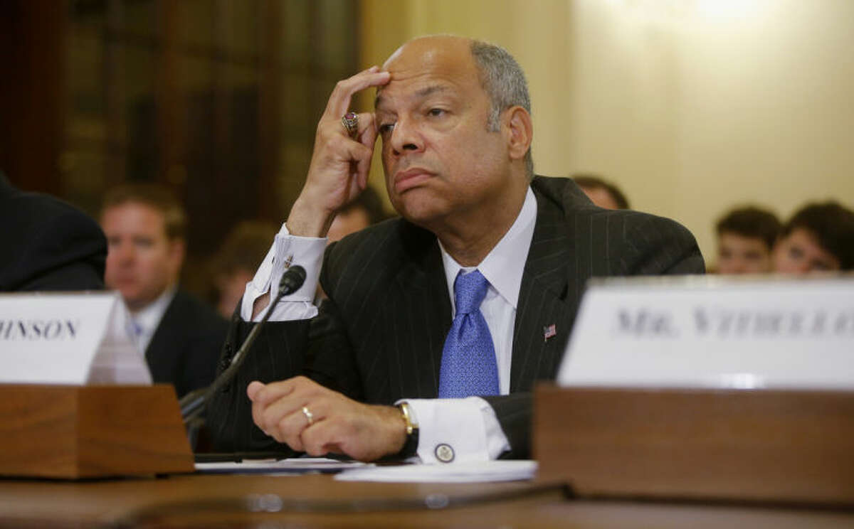 FILE - This June 24, 2014, file photo shows Homeland Security Secretary Jeh Johnson listens while testifying on Capitol Hill in Washington before the House Homeland Security Committee hearing about the growing problem of unaccompanied children crossing the border into the US. On NBC's "Meet the Press", Sunday, July 6, 2014, Johnson said that all persons regardless of age face ?“a deportation proceeding?” if they enter the country illegally. The Obama administration, he said, is ?“looking at ways to create additional options for dealing with the children in particular, consistent with our laws and our values.?” (AP Photo/Charles Dharapak, File)