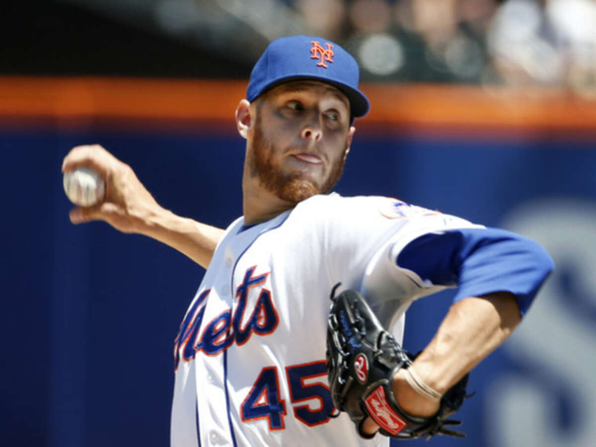 New York Mets starting pitcher Zack Wheeler delivers in the first inning of a baseball game against the Texas Rangers in New York, Sunday, July 6, 2014. (AP Photo/Kathy Willens)