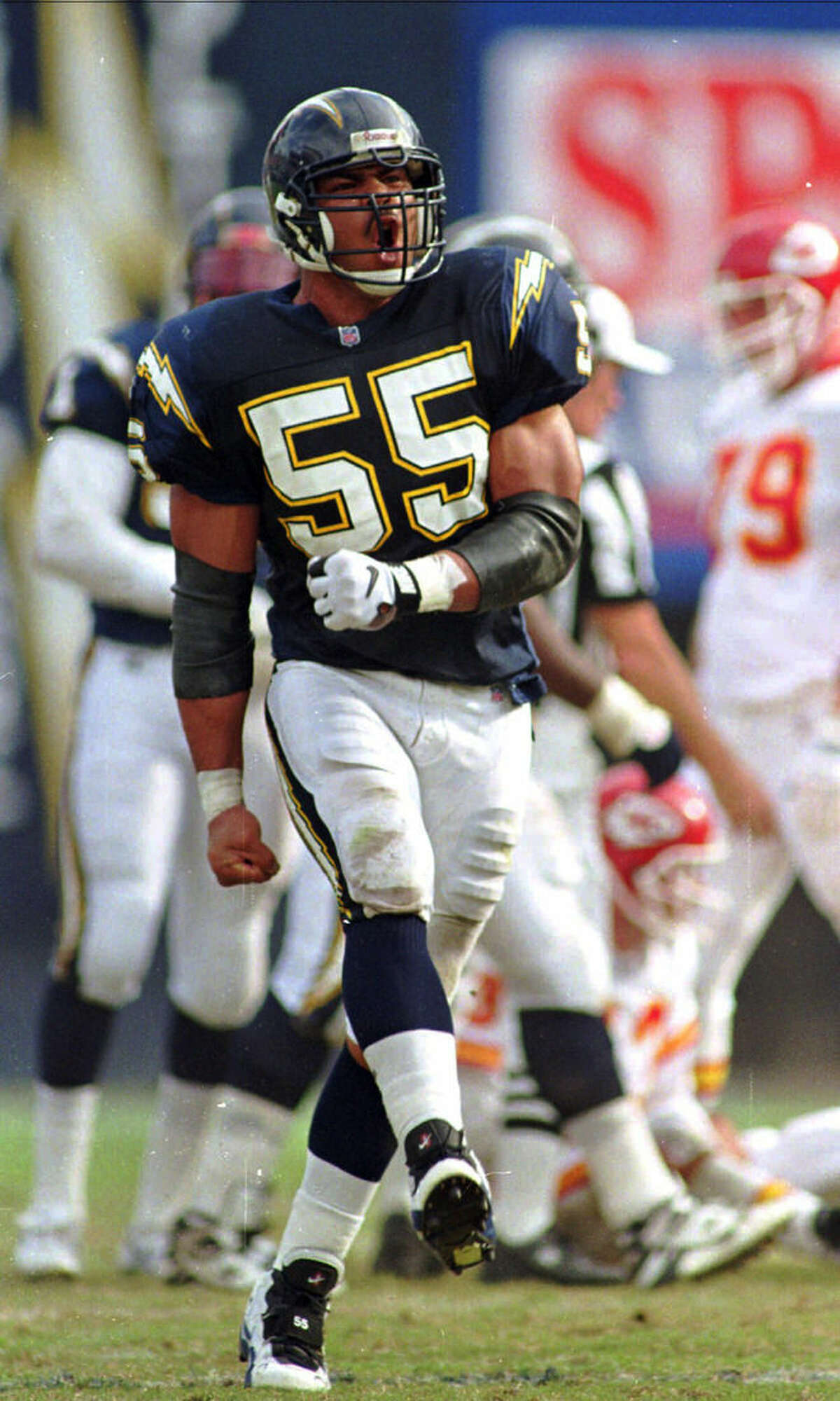 New England Patriots linebacker Junior Seau (55) walks on the