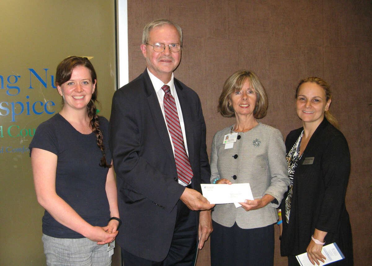 Elona Needle (far right) and David Van Buskirk of First County Bank present a check to Visiting Nurse & Hospice of Fairfield County’s Development Coordinator, Aislinn Gavin (at left) and Agency President and CEO, Sharon Bradley, in support of the Agency’s Community Health Program.
