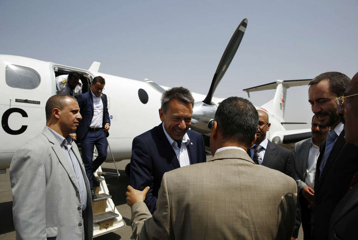 Peter Maurer, the president of the International Committee of the Red Cross, center, arrives at the international airport in Sanaa, Yemen, Saturday, Aug. 8, 2015. (AP Photo/Hani Mohammed)
