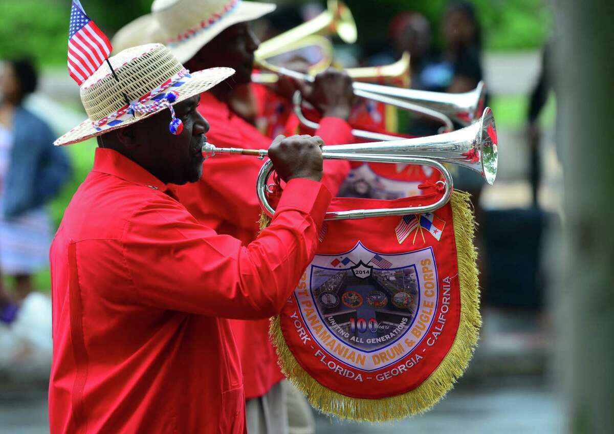 The First Panamanian Drum and Bugle Corps perform during the annual Juneteenth African-American Caribean Parade and Festival along in the parade route in downtown Bridgeport, Conn. on Saturday June 11, 2016. Despite a rain shower just after starting, hundreds of residents lined the route to watch local bands, organizations and even groups from New York City and Boston perform. Juneteenth is a uniquely American celebration commemorating the ending of slavery in the United States.