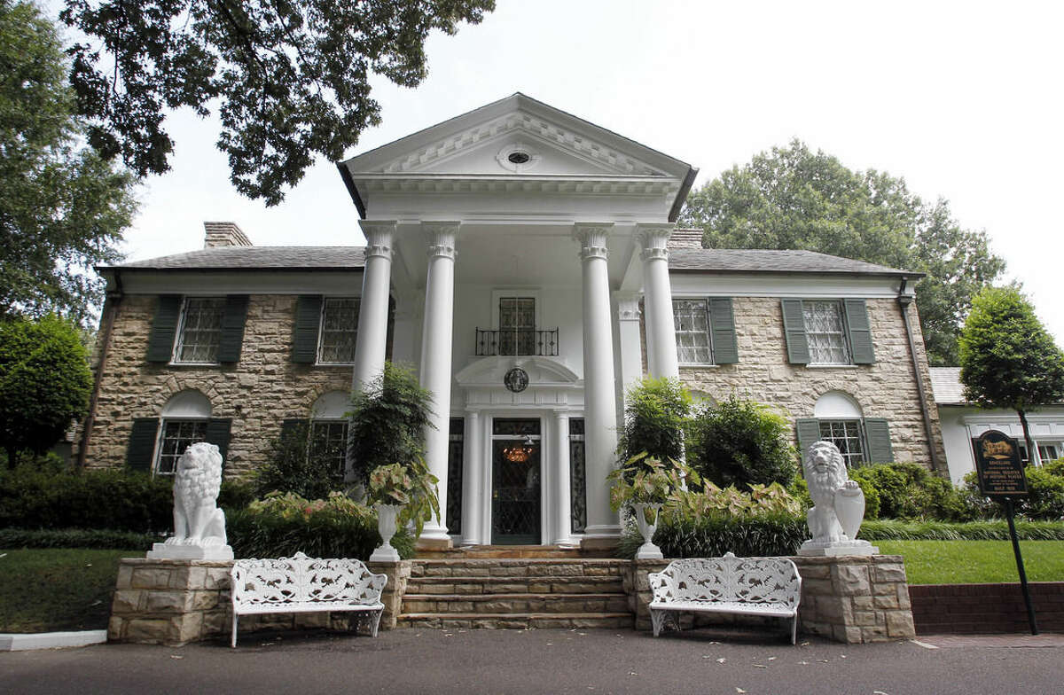 FILE - This August 2010 file photo, shows Graceland, Elvis Presley's home in Memphis, Tenn. Over a hundred authenticated artifacts are up for auction Thursday, Aug. 13, 2015, as part of Elvis Week at Graceland. (AP Photo/Mark Humphrey, File)
