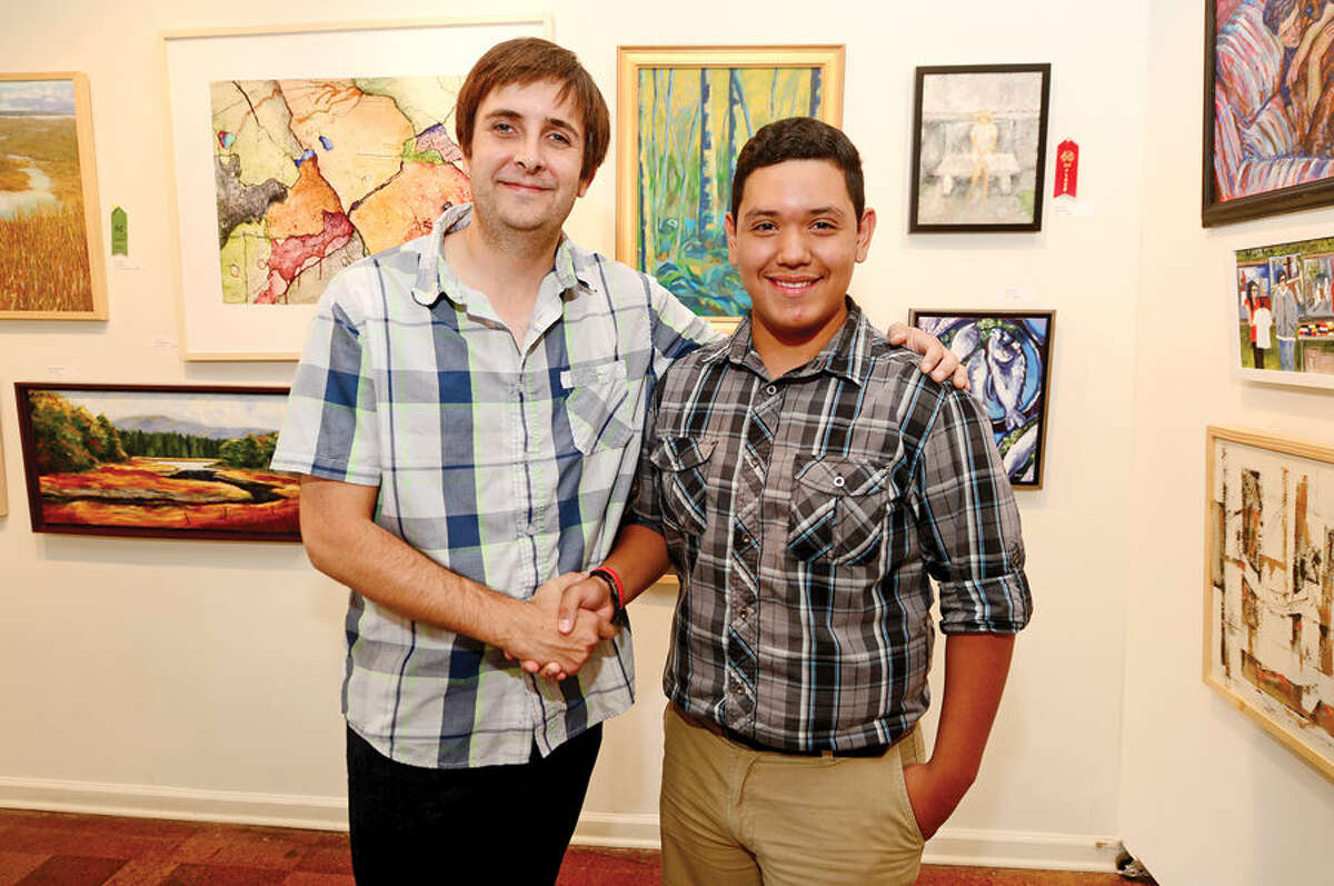 Hour photo / Erik Trautmann 14-year-old artist Leo Gonzalez, with Rowayton Arts Center Board president Bruce Horan, has formed a youth artist’s group at the RAC.