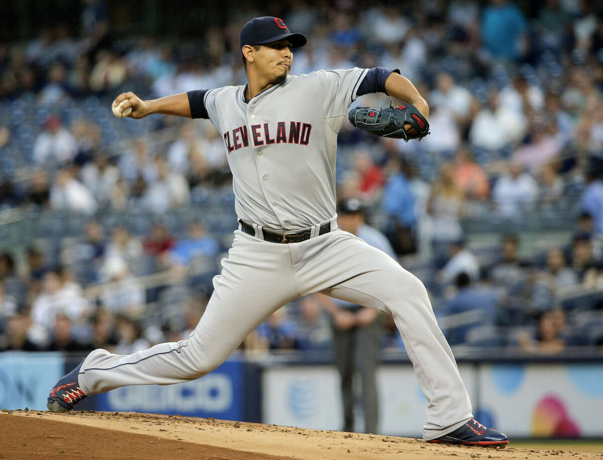 Cleveland Indians pitcher Carlos Carrasco delivers against the New York Yankees during the first inning of a baseball game, Friday, Aug. 21, 2015, in New York. (AP Photo/Julie Jacobson)