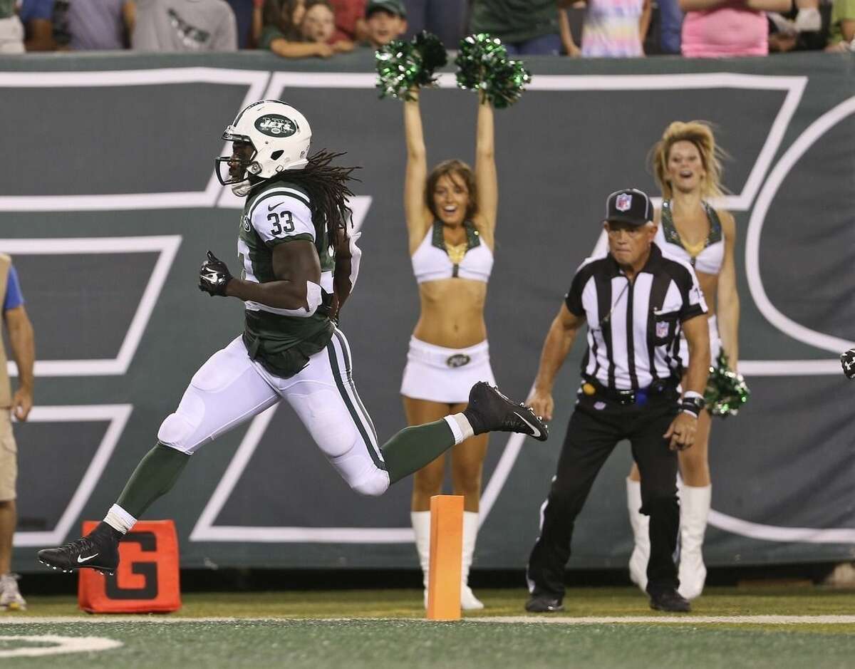 New York Jets running back Chris Ivory (33) runs for a touchdown during the first half of a preseason NFL football game against the Atlanta Falcons Friday, Aug. 21, 2015, in East Rutherford, N.J. (AP Photo/Adam Hunger)