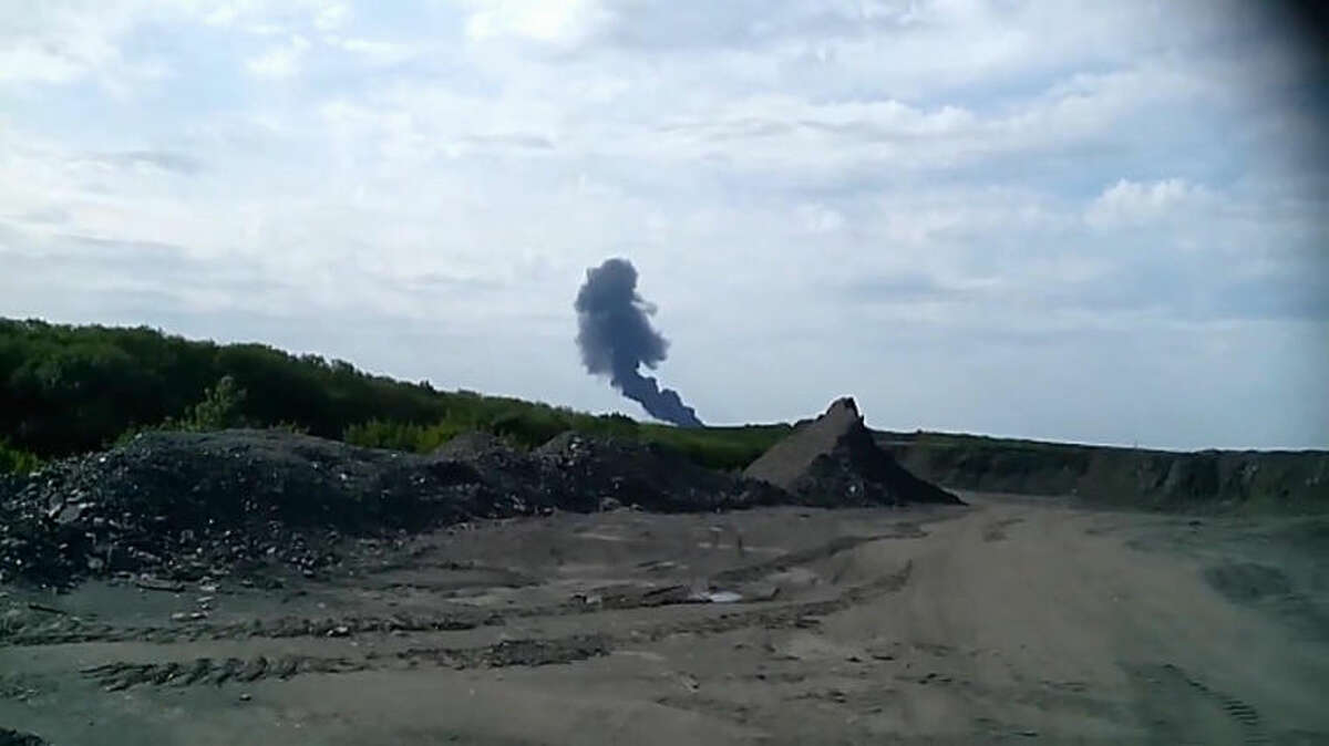 In this image taken from amateur video, Thursday July 17, 2014, Smoke rises from a fireball is seen in the distance shortly after a Malaysia Airlines passenger plane carrying 295 people was shot down Thursday as it flew over Ukraine, and plumes of black smoke rose up from the scene near the rebel-held village of Grabovo, in eastern Ukraine. Malaysia Airlines has tweeted that it lost contact with one of its flights as it was traveling from Amsterdam to Kuala Lumpur over Ukrainian airspace. (AP Photo / Amateur Video accessed by APTV) TV OUT