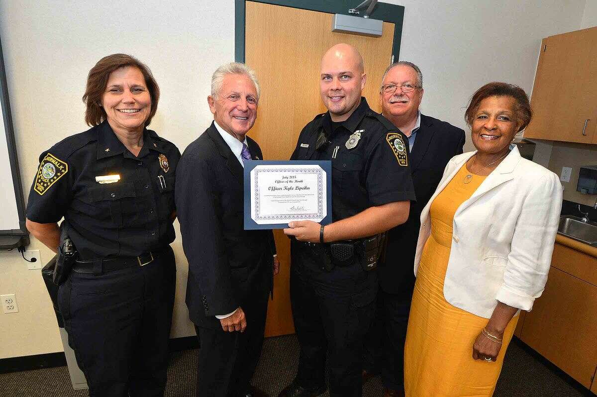 Hour Photo/Alex von Kleydorff Norwalk Police Officer Kyle Lipeika is awared July 2015 Officer of the Month by Deputy Chief Susan Zecca, Mayor Harry Rilling, Police Commissioners Charles Yost and Fran Collier-Clemmons
