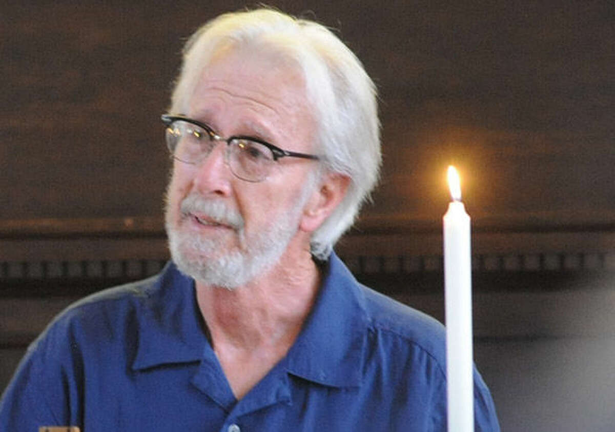 Frank Glick, deacon at First Congregational Church in Norwalk speaks Monday at the the vigil held in Norwalk for former Norwalkers, Ledell and Katherine Mulvaney, who were killed in auto accident on the Taconic Parkway on Saturday. Hour Photo/Matthew Vinci