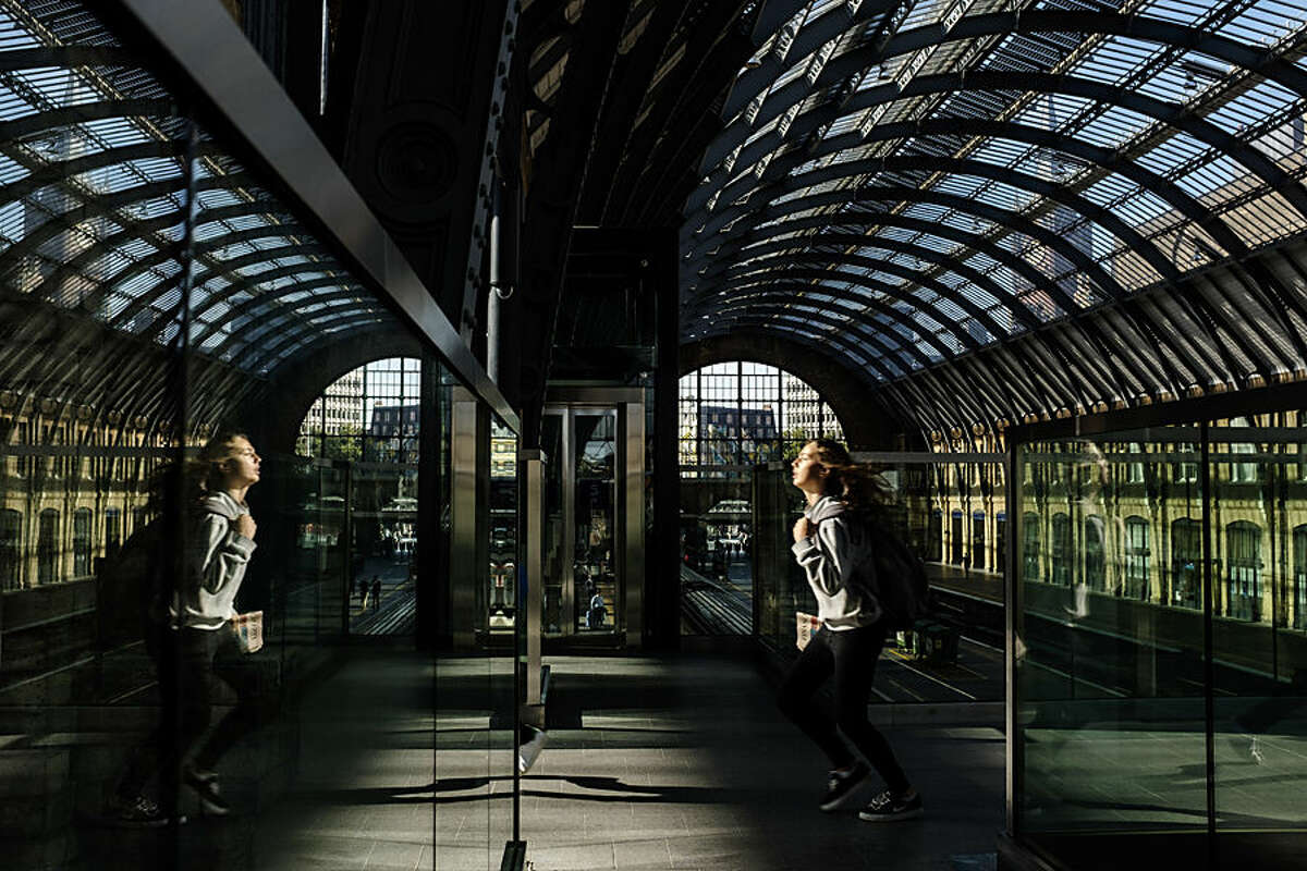 A passenger runs to catch a train at King's Cross railway station, London, Monday, Aug. 17, 2015. More than 29 million passengers annually rely on mainline train services from King's Cross, according to the British Office of Rail Regulation, making it the ninth busiest station in the country. (AP Photo/David Azia)