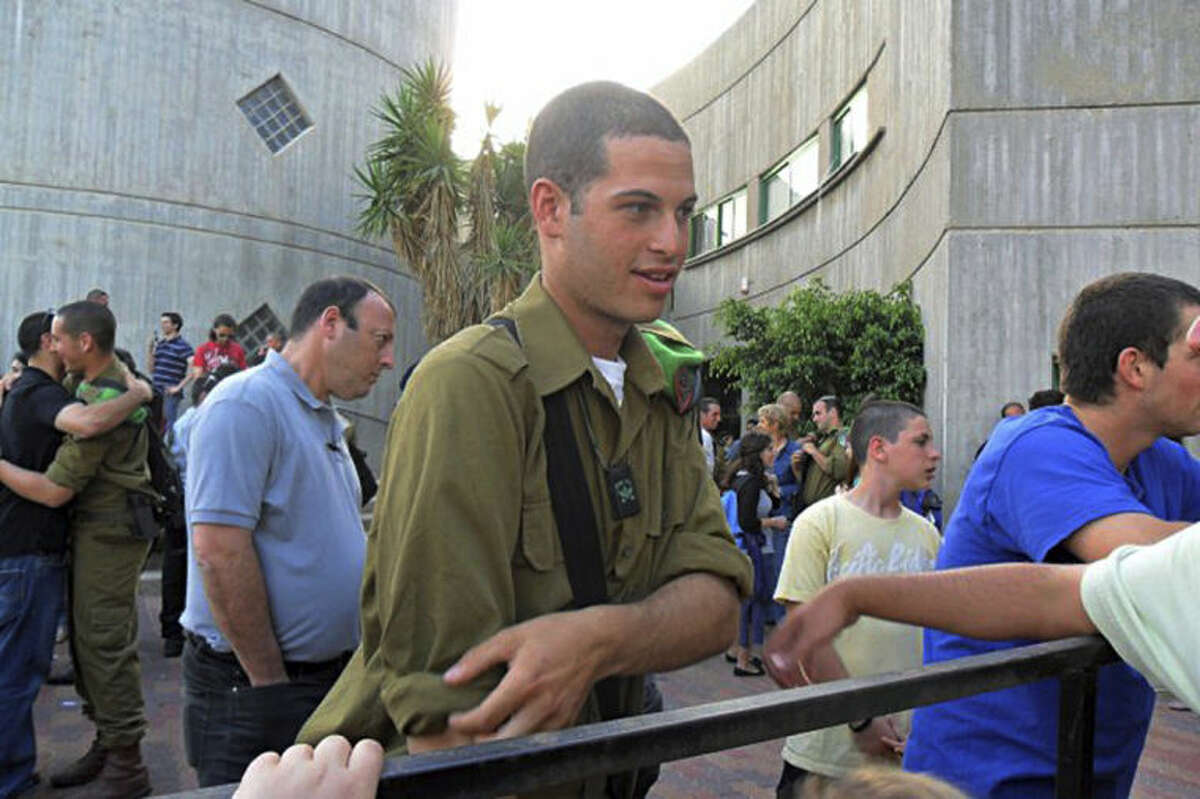 This December 2010 photo provided by Mike Fishbein shows Fishbein, a U.S.-born soldier from Los Angeles fighting for the Israel Defense Forces. The two Americans killed in fighting in the Gaza Strip followed in the footsteps of scores of Jews from around the world who have volunteered to fight for Israel. Israel calls them the lone soldiers: They are men and women in the prime of their lives who have left their parents and often comfortable lives behind in places like Sydney, London, Los Angeles and elsewhere to join the Israel Defense Forces, marching in the desert and taking up arms to defend the Jewish state. There are about 2,000 lone soldiers currently serving in the military, said Marina Rozhansky, spokeswoman at the Israel Consul General in Los Angeles. (AP Photo/Courtesy Mike Fishbein)