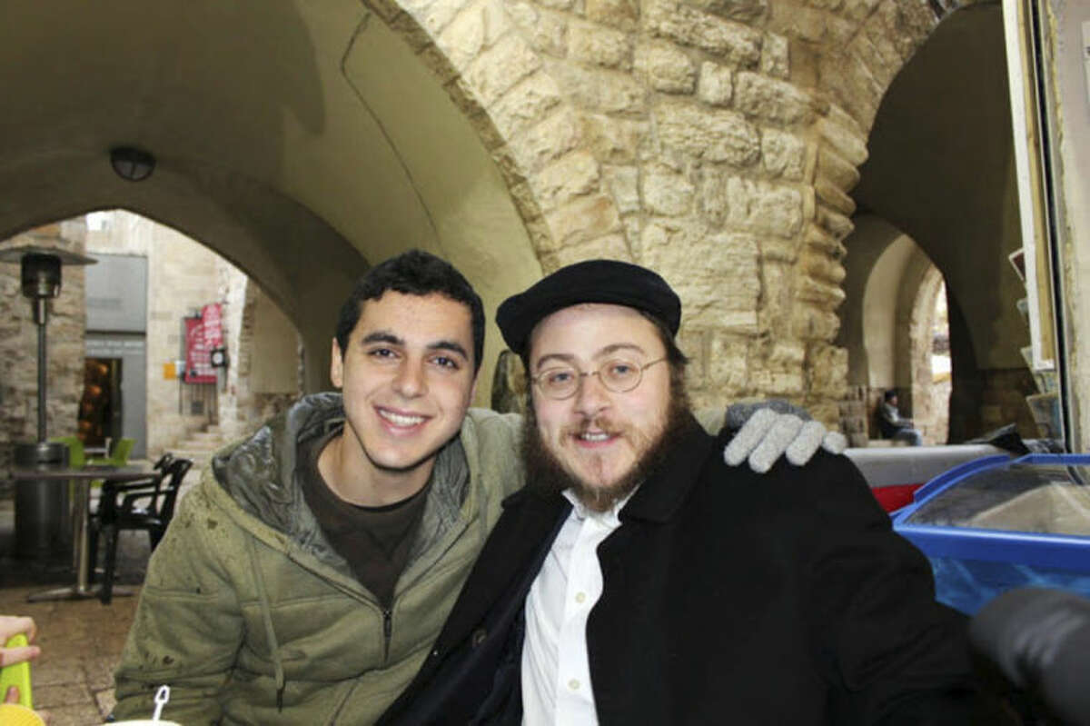 This 2012 photo provided by Rabbi Asher Hecht, shows Nissim Sean Carmeli, left, with Hecht in Jerusalem. The Israel Defense Forces said Sunday, July 20, 2014, in a statement that Carmeli was killed in combat in the Gaza Strip. Carmeli was from South Padre Island, Texas, said Deputy Consul General of Israel to the Southwest Maya Kadosh. (AP Photo/Rabbi Asher Hecht via Chabad of the Rio Grande Valley)