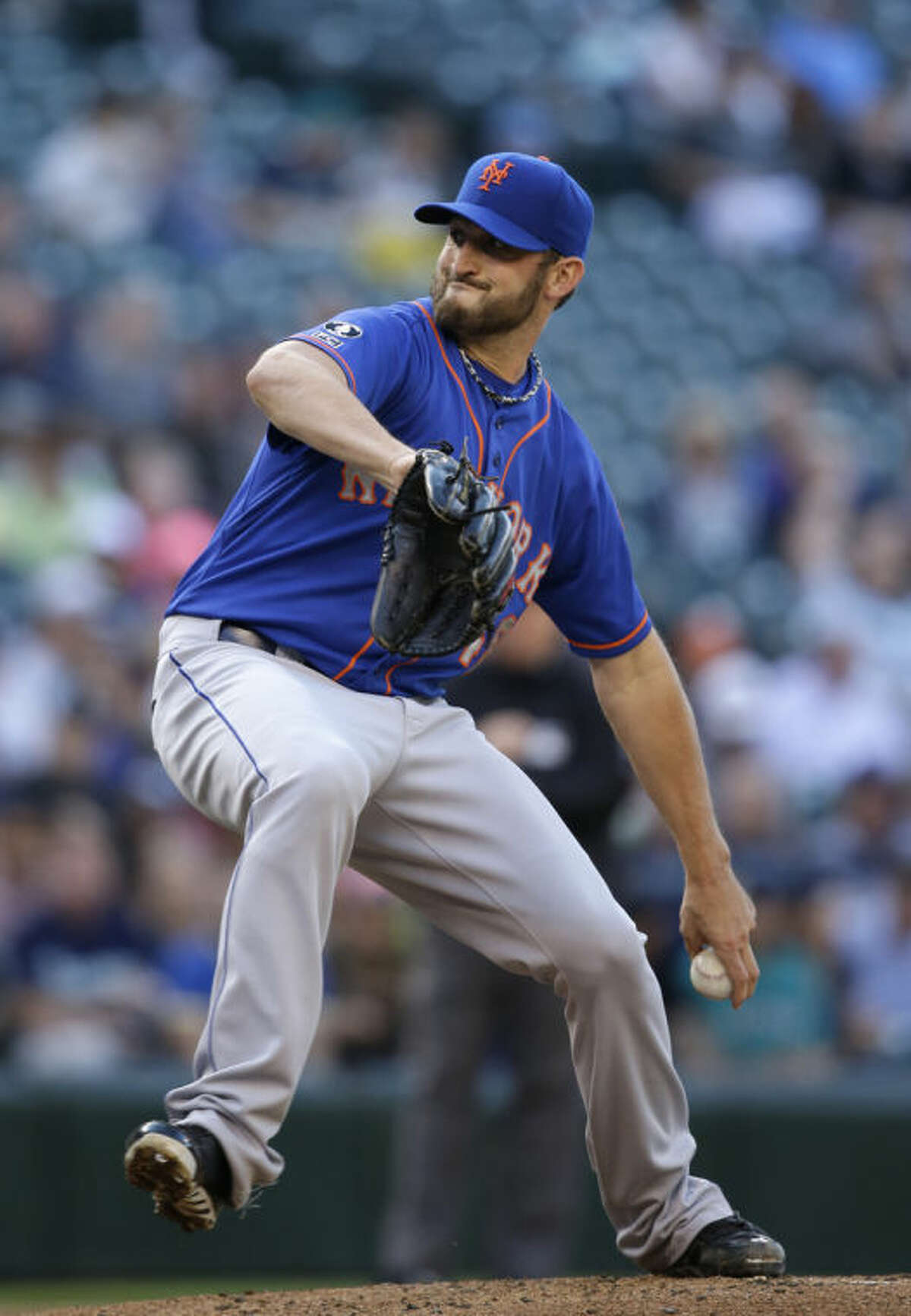 New York Mets starting pitcher Jonathon Niese throws against the Seattle Mariners in the first inning of a baseball game Monday, July 21, 2014, in Seattle. (AP Photo/Elaine Thompson)