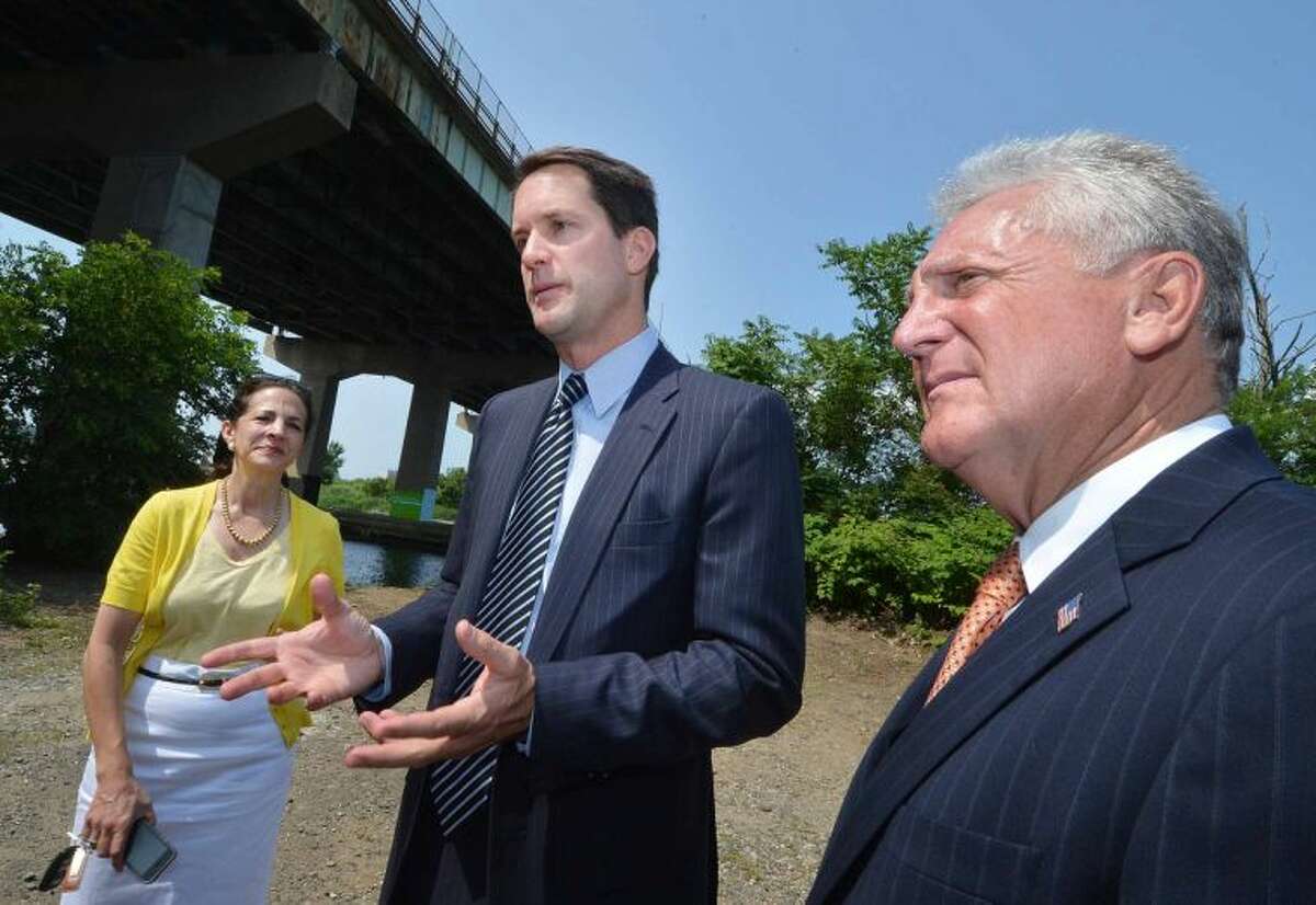 Hour Photo/Alex von Kleydorff Congressman Jim Himes, Mayor Harry Rilling and State Rep Gail Lavielle talk about the need for long-term investments in federal transportation infrastructure and the repairs needed for the I95 Yankee Doodle Bridge over the Norwalk River
